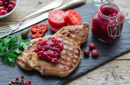 Grilled meat with cranberry sauce. Selective focusの写真素材