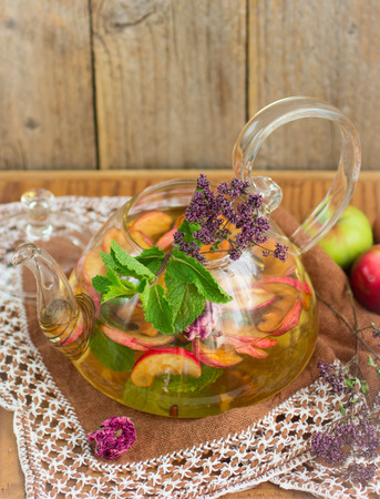 Herbal tea with apples, oregano, mint and rose. Selective focusの写真素材