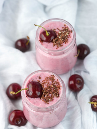 Smoothie with cherries, chocolate and nuts. Selective focusの写真素材