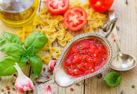 Homemade tomato sauce for pasta and meat from fresh tomatoes with garlic, Basil and spices. Selective focusの写真素材