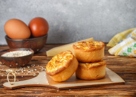 Mini pies with cheese, onion and egg. Tartlets. Delicious snack for gourmands. Selective focus