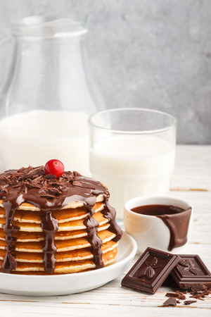 Pancake with chocolate on a white plate. Delicious Breakfast. Selective focusの写真素材