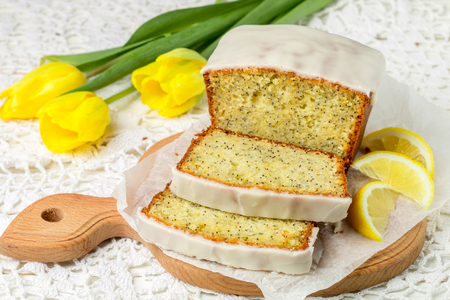 Homemade lemon cake with poppy seeds and sugar glaze. Selective focusの写真素材