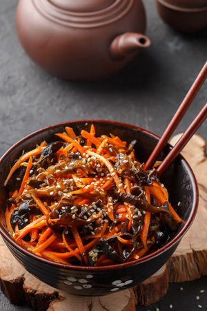 Asian salad carrots and mushrooms with sesame seeds. Selective focusの写真素材