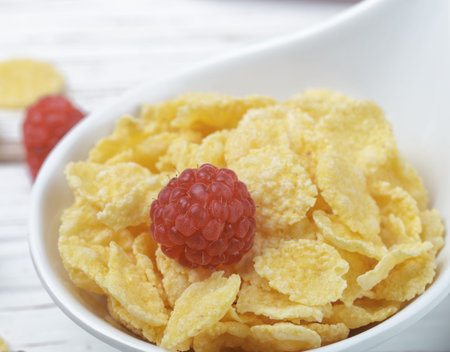 Cornflakes with fresh raspberries. Healthy Breakfast. Selective focus