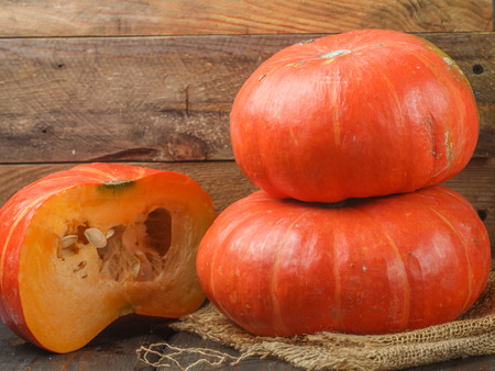 Colorful organic whole pumpkin on the table. A rustic style. Thanksgiving. Halloween. Selective focus. Copy spaceの写真素材