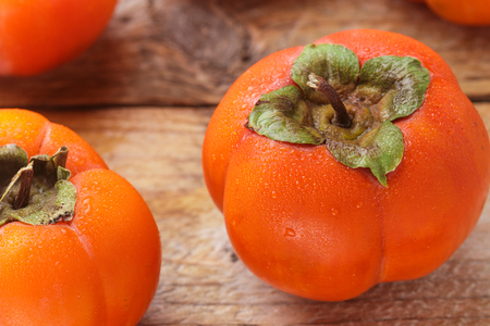 Fresh ripe persimmon with water drops. Selective focusの写真素材