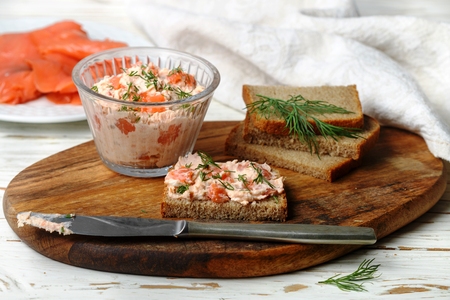 Delicious mousse, riyet, pate, dip of Smoked Salmon (trout), Cream Cheese, dill and horseradish on Rye Bread Slices. Gourmet appetizer. Selective focusの写真素材