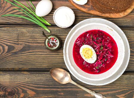 Beetroot soup. Holodnik. Cold summer vegetarian dish of bees, cucumbers, potatoes, eggs, green onions, dill and parsley with kefir or sour cream. Traditional Lithuanian (ukrainian, russian) cuisineの写真素材