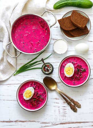 Beetroot soup. Holodnik. Cold summer vegetarian dish of bees, cucumbers, potatoes, eggs, green onions, dill and parsley with kefir or sour cream. Traditional Lithuanian (ukrainian, russian) cuisineの写真素材