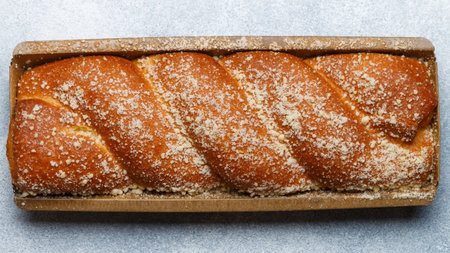 Traditional freshly baked whole strudel close-up. Fresh homemade wicker pastries with fruit or berry...