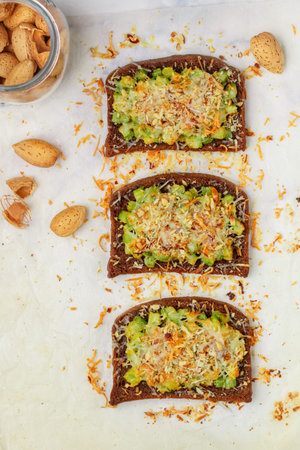 Delicious appetizer of rye bread baked with zucchini, parmesan cheese and almonds. Bruschetta. Bread...