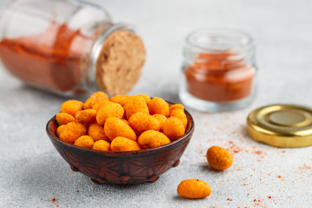 Fried crispy peanuts with salt and hot pepper. Nuts with chili. A spicy snack. Appetizer for beer....