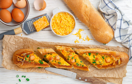 Baguette boat. breakfast. Hot big sandwich in baguette bread with eggs, sausage, cheese and green...