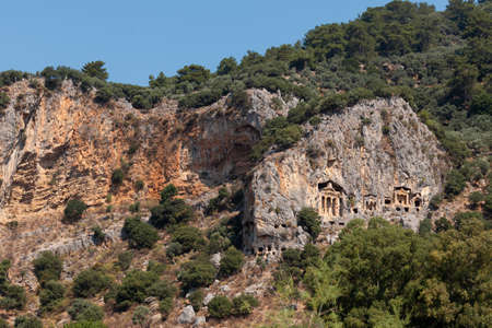 Lycian Royal mountain tombs carved into the rocks near the town of Dalyan in the province of Marmaris in Turkeyの写真素材
