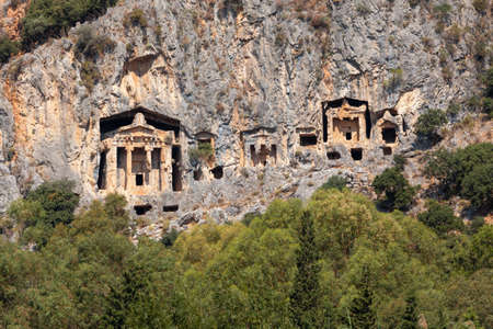 Lycian Royal mountain tombs carved into the rocks near the town of Dalyan in the province of Marmaris in Turkeyの写真素材