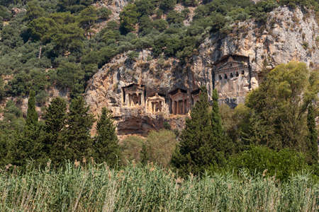Lycian Royal mountain tombs carved into the rocks near the town of Dalyan in the province of Marmaris in Turkeyの写真素材