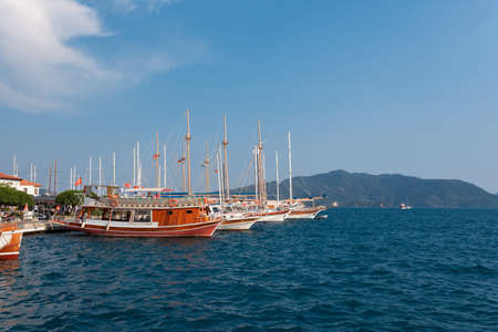 Boats are docked next to a body of waterのeditorial素材