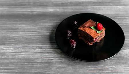 homemade chocolate brownies on dark background.の写真素材
