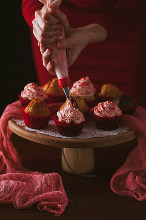 on muffins squeezed creamの写真素材