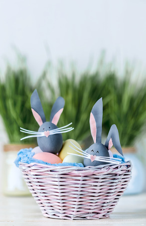 Cute creative photo with easter eggs, some eggs as the Easter Bunnyの写真素材