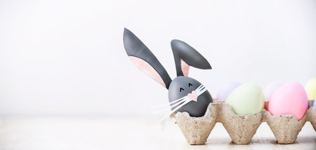 Cute creative photo with easter eggs, some eggs as the Easter Bunny