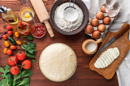 Step-by-step boss makes a pizza margarita. Dough and pizza ingredientsの写真素材