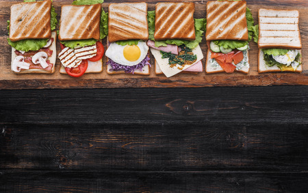 Six sandwiches with different ingredientsの写真素材