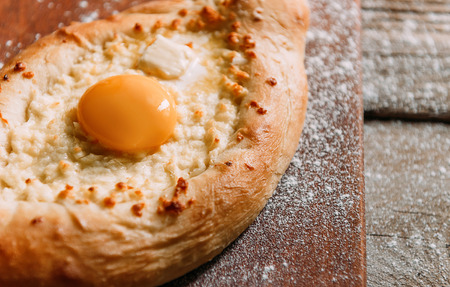 Khachapuri in Adzharian with Adyghe cheese, cheese and yolk. Traditional Caucasian foodの写真素材