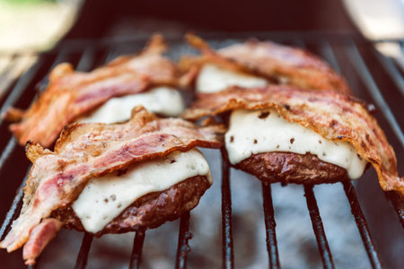 Juicy burger cutlets for burger are grilledの写真素材