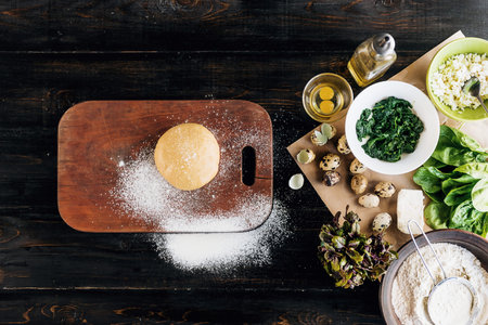 Step by step the chef prepares ravioli with ricotta cheese, yolks quail eggs and spinach with spices. A set of products for ravioliの写真素材