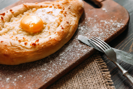 Khachapuri in Adzharian with Adyghe cheese, cheese and yolk. Traditional Caucasian foodの写真素材