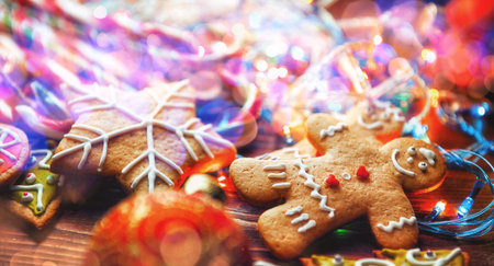 Christmas still life. homemade ginger biscuits, cane candy, on a wooden background.