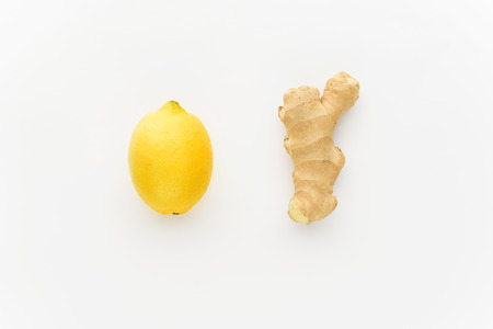 minimalism lemon and ginger on a white background. concept of increasing immunity in winterの写真素材