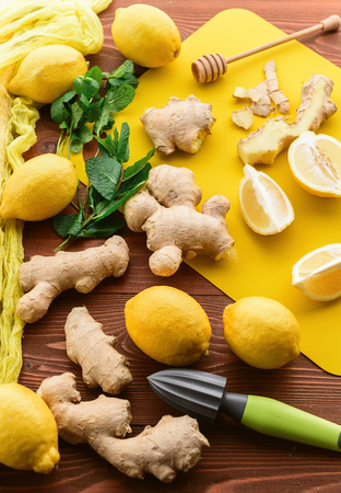 lemon and ginger with mint and honey. on a wooden background in a rustic style.の写真素材