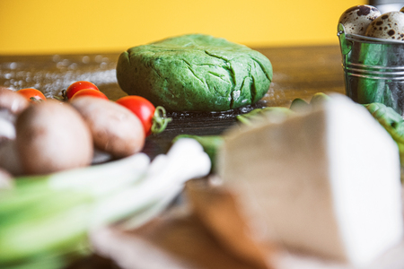 Ingredients for green ravioli in the form of heart from spinach with ricotta. prepared by the hostess for a festive dinner on St. Valentine's Dayの写真素材
