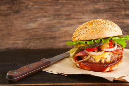 mouth-watering delicious homemade burger used to chop beef on the wooden table.の写真素材