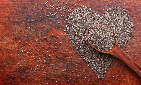 heart made of chia seeds on a wooden background. concept of health and healthy eatingの写真素材