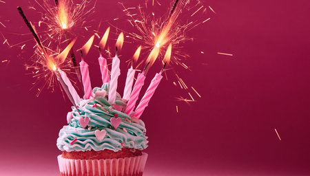 Muffin with cream in a lot of candles and Bengal lightsの写真素材