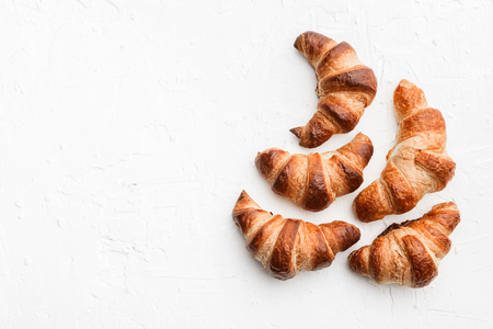 four croissants on a white backgroundの写真素材