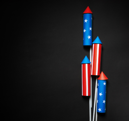 July 4, rockets for fireworks on a blue red background with space for text. in the style of minimalismの写真素材
