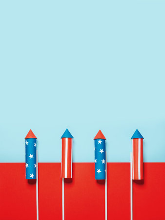 July 4, rockets for fireworks on a blue red background with space for text. in the style of...