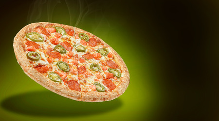 delicious fresh Italian pizza in the air just from the oven. there is space for textの写真素材