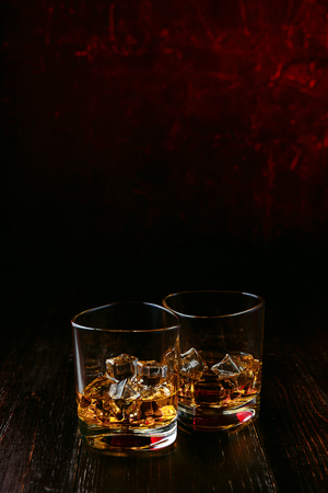 whiskey with ice in modern glassesの写真素材