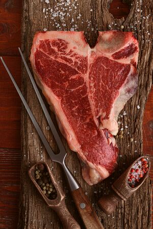 raw tbone steak for blessing day and christmas holidays. A piece of fresh organic farm meatの写真素材