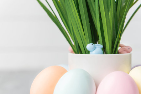 decorative easter eggs on a light wooden background. Easter-themed background with place for text