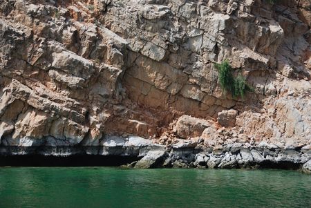 Cliff from sandstone and Indian Oceanの写真素材