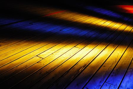 Yellow and blue Illuminated on old wooden deckの写真素材