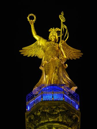 Statue of Angel On Victory Column Siegessaeule in the night, Berlin (Germany)の写真素材