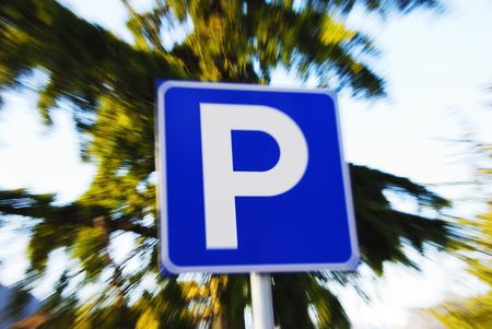 Parking sign against nature background with zooming effect.の写真素材